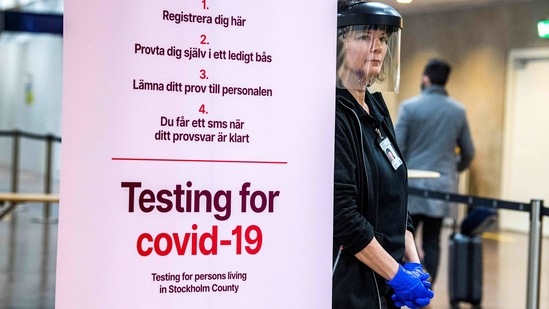 Asa Wernsten works at the sampling station for the coronavirus (Covid-19) test at Stockholm's Arlanda Airport, for travellers who arrive with international flights on February 22, 2021. - Sweden in January adopted a pandemic law giving the government new powers to curb the spread of the virus. The country has never imposed the type of lockdown seen elsewhere in Europe, controversially relying on mostly non-coercive measures. It has however gradually tightened measures since November. (Photo by Claudio BRESCIANI / TT News Agency / AFP) / Sweden OUT (AFP) Asa Wernsten works at the sampling station for the coronavirus (Covid-19) test at Stockholm's Arlanda Airport, for travellers who arrive with international flights on February 22, 2021. - Sweden in January adopted a pandemic law giving the government new powers to curb the spread of the virus. The country has never imposed the type of lockdown seen elsewhere in Europe, controversially relying on mostly non-coercive measures. It has however gradually tightened measures since November. (Photo by Claudio BRESCIANI / TT News Agency / AFP) / Sweden OUT (AFP)