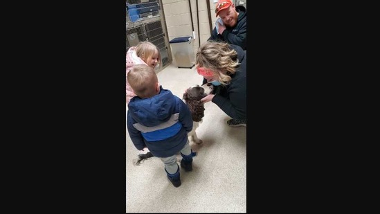 The image shows the dogs reuniting with its family.(Facebook/@KentCountyAnimalShelter)