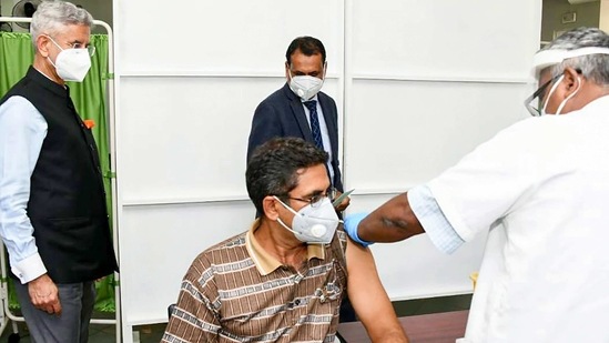 External Affairs Minister S Jaishankar watches as a medic administers made-in-India Maitri vaccine to a Mauritius resident, in Port Louis. (PTI) External Affairs Minister S Jaishankar watches as a medic administers made-in-India Maitri vaccine to a Mauritius resident, in Port Louis. (PTI)