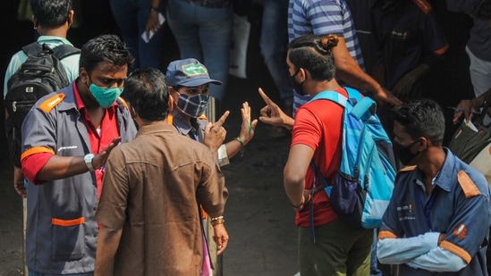 Mumbai: BMC officials penalise a commuter for not wearing masks, amid rise in coronavirus cases across Maharashtra, in Mumbai, Tuesday, Feb. 23, 2021. (PTI Photo)(PTI02_23_2021_000222A)(PTI)