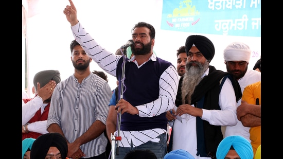 Lakha Sidhana, wanted by Delhi Police in the Republic Day violence case, speaking at a rally in Mehraj villageof Punjab’s Bathinda district on Tuesday. (Sanjeev Kumar /HT)