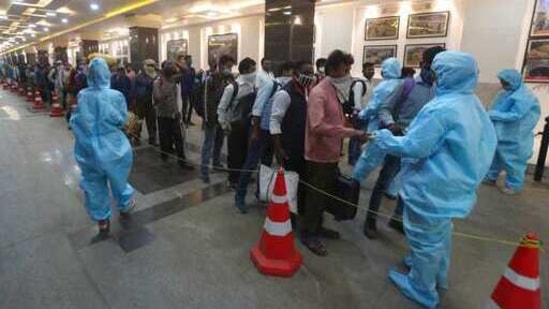 Passengers line up to get their temperatures checked at a train station in Mumbai, Maharashtra state, India, Monday, Feb. 22, 2021. Cases of COVID-19 are increasing in some parts of India after months of a steady nationwide decline, prompting authorities to impose lockdowns and other virus restrictions.(AP Photo/Rafiq Maqbool) (AP) Passengers line up to get their temperatures checked at a train station in Mumbai, Maharashtra state, India, Monday, Feb. 22, 2021. Cases of COVID-19 are increasing in some parts of India after months of a steady nationwide decline, prompting authorities to impose lockdowns and other virus restrictions.(AP Photo/Rafiq Maqbool) (AP)