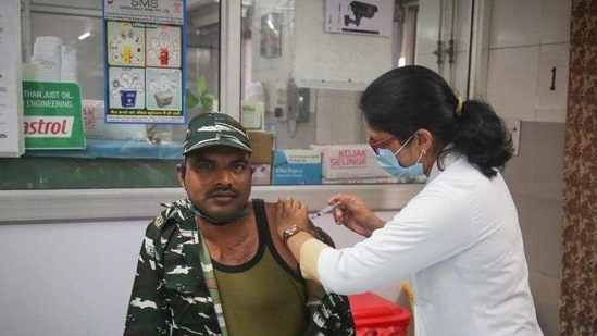 CRPF personnel being vaccinated against Covid-19, at Hindu Rao Hospital in New Delhi. (Sanchit Khanna/HT Photo)