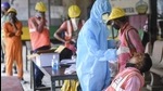 A BMC health worker collects swab sample of a construction worker for Covid-19 test, at Siddhivinayak Metro site in Mumbai on February 25. (PTI) A BMC health worker collects swab sample of a construction worker for Covid-19 test, at Siddhivinayak Metro site in Mumbai on February 25. (PTI)