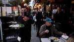 A server carries food for a customer at Ye Olde King's Head in Santa Monica, California. (AP) A server carries food for a customer at Ye Olde King's Head in Santa Monica, California. (AP)