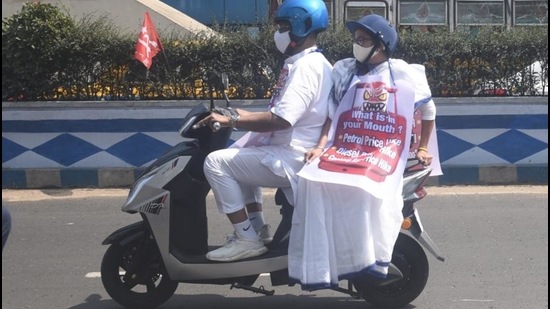 CM Mamata Banerjee on her way to her office on an electric scooter on Thursday. (Samir Jana/HT photo)