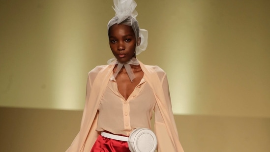 A model wears a creation by fashion designer Joy Meribe as part of the Black Lives Matter Fall/Winter 2021/22 collective fashion show, presented in Milan, Italy, Wednesday, Feb. 17, 2021. 2021. (AP)