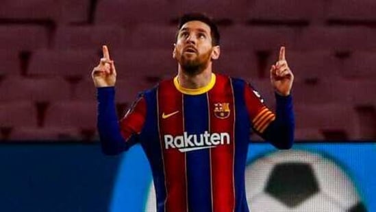 Barcelona's Lionel Messi celebrates after scoring the opening goal during the Spanish La Liga soccer match between FC Barcelona and Elche at the Camp Nou stadium in Barcelona, Spain.(AP)