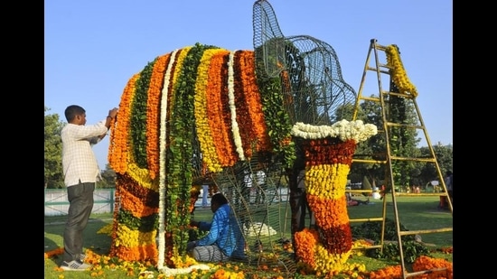 Workers readying a topiary for the 49th Rose Festival in Chandigarh on a sunny Thursday afternoon. (Keshav Singh/HT)