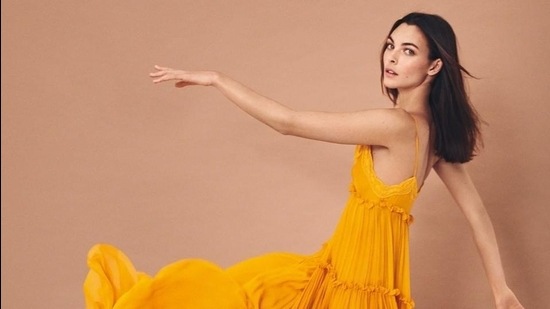 A model sports a vibrant yellow, tiered, pleated, strappy sundress from the label’s SS21 collection (Photo: Instagram/AlbertaFerretti)