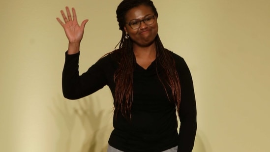 Fashion designer Joy Meribe waves at the end of the Black Lives Matter Fall/Winter 2021/22 collective fashion show, presented in Milan, Italy, Wednesday, Feb. 17, 2021. 2021.(AP)