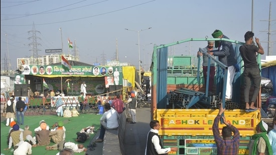 New Delhi, India - February 22, 2021: Demonstrators unloading consturction material for tents at the Ghazipur border protest site as the agitation against new farm laws continues, in New Delhi, India on Monday, February 22, 2021. (Photo by Sakib Ali /Hindustan Times)