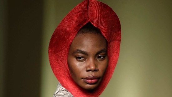 A model wears a creation by fashion designer Frida Kiza as part of the Black Lives Matter Fall/Winter 2021/22 collective fashion show, presented in Milan, Italy, Wednesday, Feb. 17, 2021. 2021. (AP)
