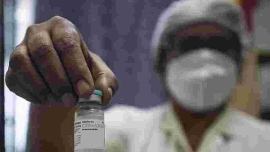 A health worker shows Bharat Biotech’s Covaxin, in Pune earlier in January this year. (HT file photo)