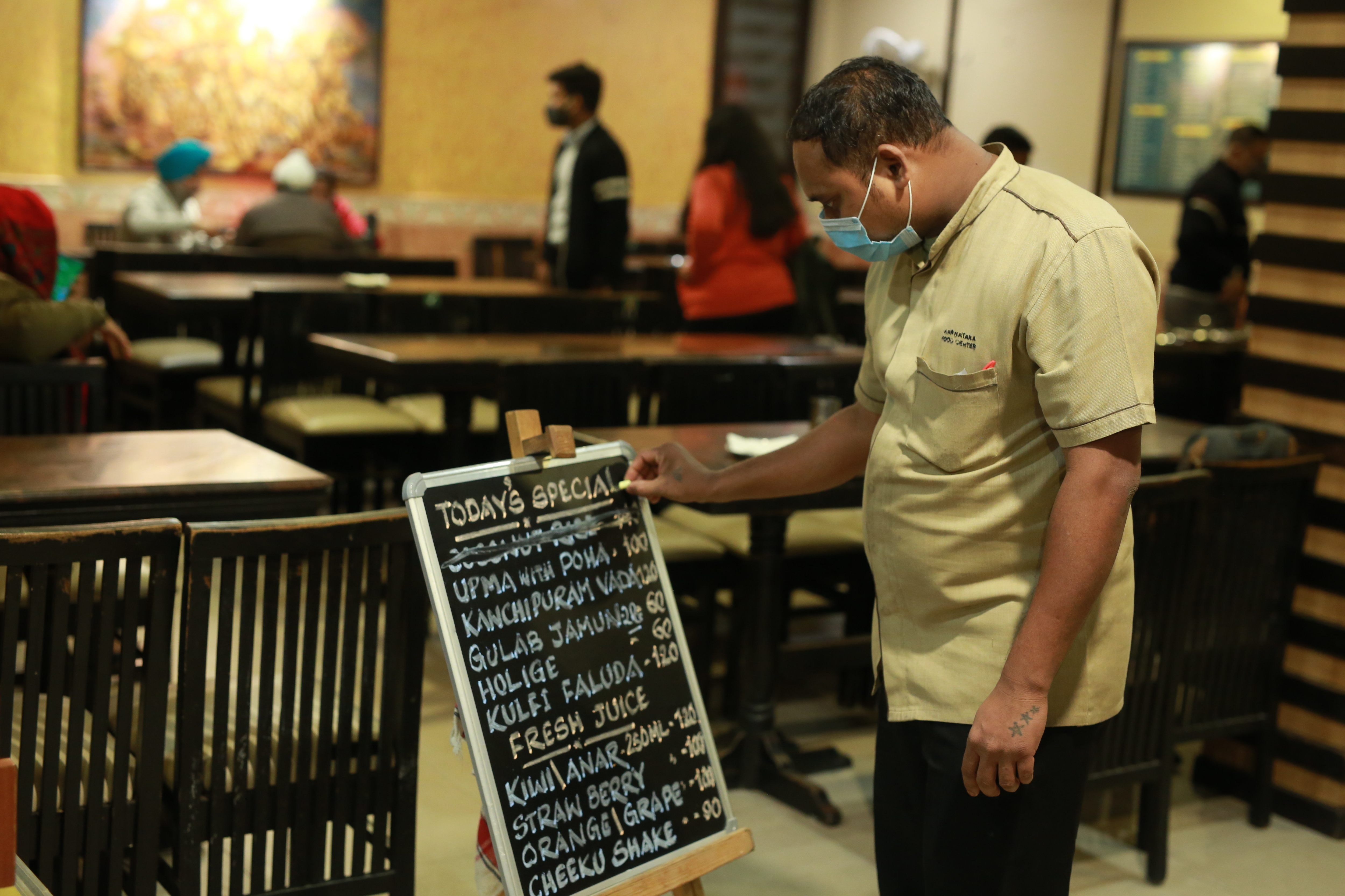 A blackboard features all the dishes for the day at Karnataka Food Centre. (Photo: Manoj Verma/HT) A blackboard features all the dishes for the day at Karnataka Food Centre. (Photo: Manoj Verma/HT)