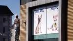 A picture of a French bulldog is featured above the entrance of Dog-E-Den Hollywood near an area on North Sierra Bonita Ave. where Lady Gaga's dog walker was shot and two of her French bulldogs stolen, Thursday, Feb. 25, 2021, in Los Angeles. The dog walker was shot once Wednesday night and is expected to survive his injuries. The man was walking three of Lady Gaga's dogs at the time but one escaped. (AP Photo/Chris Pizzello)(AP) A picture of a French bulldog is featured above the entrance of Dog-E-Den Hollywood near an area on North Sierra Bonita Ave. where Lady Gaga's dog walker was shot and two of her French bulldogs stolen, Thursday, Feb. 25, 2021, in Los Angeles. The dog walker was shot once Wednesday night and is expected to survive his injuries. The man was walking three of Lady Gaga's dogs at the time but one escaped. (AP Photo/Chris Pizzello)(AP)