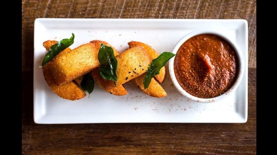 Tiffin Asha, in Portland, Oregon: Spanning the food of Andhra Pradesh, Karnataka, Kerala and Tamil Nadu, and served with a twist. Alongside the familiar dosas are pakoras ones with free-range chicken (with cardamom honey, pickled kale & creamy yogurt cheese), idli fry, pulled pork vindaloo and coconut ladoos.(Courtesy: Tiffin Asha)