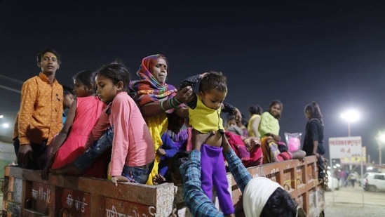 Devotees arrive at Sangam, the sacred confluence of the rivers Ganga, Yamuna and the mythical Saraswati for Magh mela festival, in Prayagraj, India Tuesday, Feb. 16, 2021.(AP)