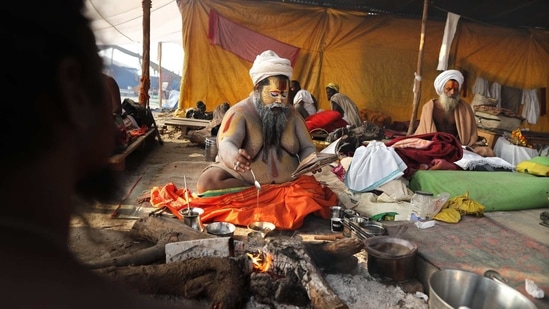 Holy men pray on the bank of the river Ganges during Magh mela festival, in Prayagraj, India Tuesday, Feb. 16, 2021.(AP)