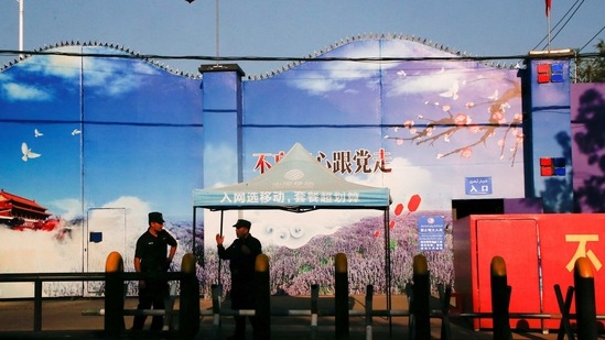 FILE PHOTO: Security guards stand at the gates of what is officially known as a vocational skills education centre in Huocheng County in Xinjiang Uighur Autonomous Region, China September 3, 2018.REUTERS/Thomas Peter/File Photo(REUTERS)