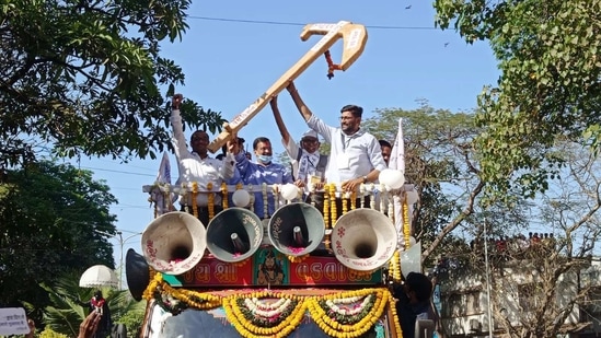 Delhi CM Arvind Kejriwal and Aam Aadmi Party leaders hold a plough as they participate in a roadshow, in Surat on Friday. (ANI Photo) Delhi CM Arvind Kejriwal and Aam Aadmi Party leaders hold a plough as they participate in a roadshow, in Surat on Friday. (ANI Photo)