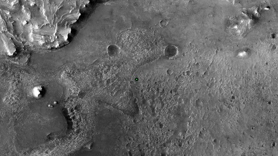 This image shows with a green dot where NASA’s Perseverance rover landed in Jezero Crater on Mars on February 18. The Perseverance rover will characterize the planet's geology and past climate, pave the way for human exploration of the Red Planet, and be the first mission to collect and cache Martian rock and regolith (broken rock and dust).(NASA / JPL-Caltech/ University of Arizona)