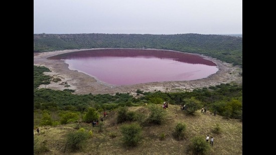 Lonar Lake in Maharashtra that turned pink recently. “For months, people who wanted to visit kept asking ‘Is this true?’ ‘Did someone colour the water?’ ‘Is the colour still the same?’,” says Sailesh Sadar, a local tourist guide. (Pratik Chorge/HT PHOTO) Lonar Lake in Maharashtra that turned pink recently. “For months, people who wanted to visit kept asking ‘Is this true?’ ‘Did someone colour the water?’ ‘Is the colour still the same?’,” says Sailesh Sadar, a local tourist guide. (Pratik Chorge/HT PHOTO)