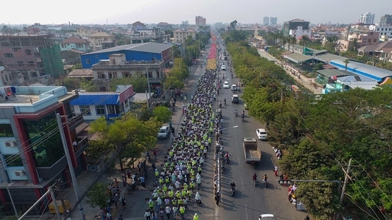 EDITORS NOTE: Graphic content / This aerial view shows protesters marching during a demonstration against the military coup in Mandalay on February 26, 2021. (Photo by STR / AFP)(AFP)