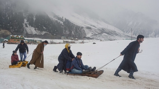 Sonamarg: Tourists take sledge ride after fresh snowfall during Sonamarg Winter Festival, at Sonamarg in Ganderbal district 110 km�s from Srinagar, (PTI)