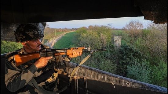 Jammu: A BSF personnel keeps vigil along the International border in Jammu, Thursday. (PTI)