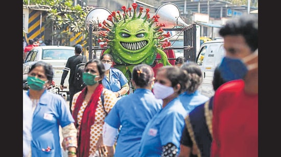 Health workers participate in a Covid-19 awareness campaign at Dharavi, on Friday. (Pratik Chorge/HT Photo)