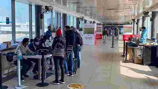Covid-19 testing setup for the passenger coming from United Kingdom, amid mounting concern over the new strain of the virus, at Delhi Airport in New Delhi.(PTI) Covid-19 testing setup for the passenger coming from United Kingdom, amid mounting concern over the new strain of the virus, at Delhi Airport in New Delhi.(PTI)