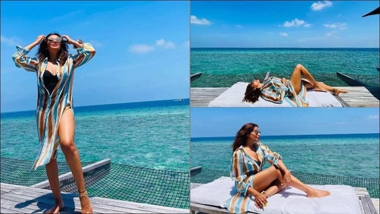 Bipasha Basu oozes oomph in barely buttoned shirt dress over bikini at Maldives(Instagram/bipashabasu)