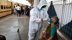 A health worker wearing a PPE kit collects a swab sample of an old lady for the COVID-19 test as she arrives at Dadar railway station, in Mumbai on Friday. (ANI Photo) A health worker wearing a PPE kit collects a swab sample of an old lady for the COVID-19 test as she arrives at Dadar railway station, in Mumbai on Friday. (ANI Photo)