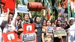 Indian youth Congress supporters with posters, cylinders shout slogans during a protest against the hike in fuel price outside the residence of Textiles Minister Smriti Irani, in New Delhi on Saturday. (ANI Photo) Indian youth Congress supporters with posters, cylinders shout slogans during a protest against the hike in fuel price outside the residence of Textiles Minister Smriti Irani, in New Delhi on Saturday. (ANI Photo)