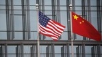 Chinese and US flags flutter outside the building of an American company in Beijing, China. (REUTERS) Chinese and US flags flutter outside the building of an American company in Beijing, China. (REUTERS)
