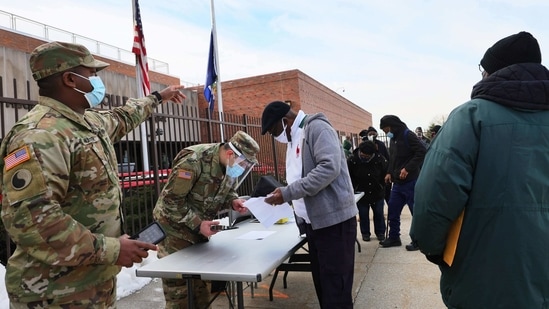 National Guard soldiers help to sign up people for their vaccination appointment at the York College coronavirus (Covid-19) vaccination site in New York City.(AFP file photo) National Guard soldiers help to sign up people for their vaccination appointment at the York College coronavirus (Covid-19) vaccination site in New York City.(AFP file photo)