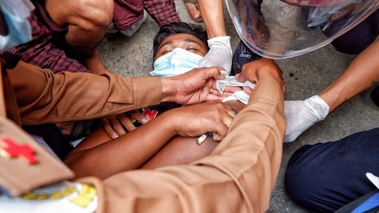 A injured man lies on the ground after the police fired rubber bullets during protests against the military coup, in Mandalay, Myanmar in this file picture from February 20. Credit: Reuters/For Representational Purposes(Reuters)