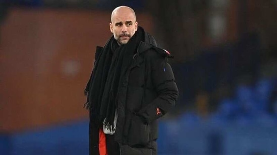 FILE PHOTO: Soccer Football - Premier League - Everton v Manchester City - Goodison Park, Liverpool, Britain - February 17, 2021 Manchester City manager Pep Guardiola before the match Pool via REUTERS/Michael Regan (Pool via REUTERS)