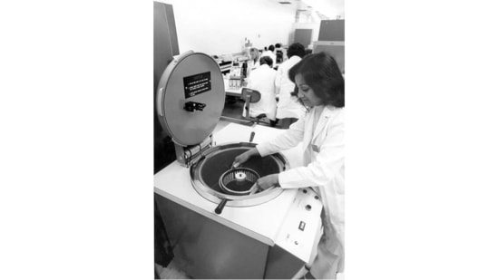 Intel kept improving on the chip, coming out with smaller, more powerful versions. Manufacturing was simple. Semiconductors were placed in water and then a vacuum was drawn on them. A technician such as this one operated a Veeco Leak Detector. If a semiconductor had a leak, the water would destroy the integrated circuit.(Intel)