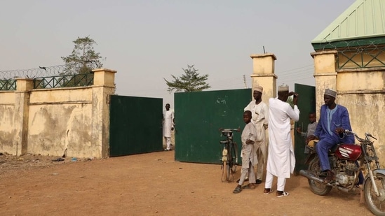 Parents of kidnapped students of Government Girls Junior Secondary School wait for information about family members following an attack by gunmen in Jangebe, Nigeria.(AP)