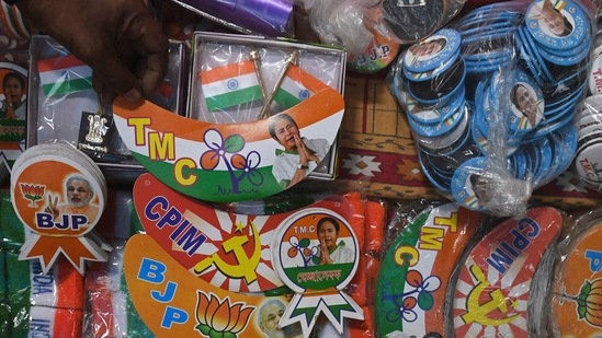 A shopkeeper displays campaigning material of political parties for sale for West Bengal assembly elections 2021, in Kolkata on Friday.(AFP Photo) A shopkeeper displays campaigning material of political parties for sale for West Bengal assembly elections 2021, in Kolkata on Friday.(AFP Photo)