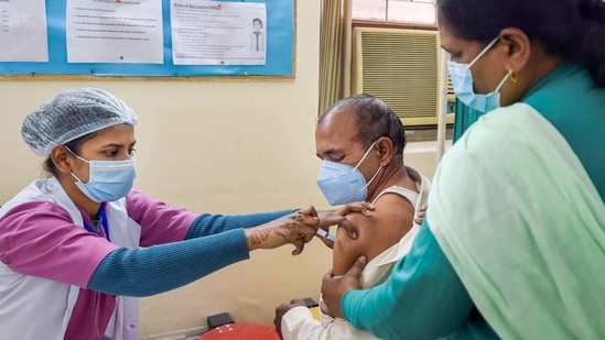 A frontline worker receives the dose of Covaxin vaccine, at a hospital in New Delhi. (PTI Photo)