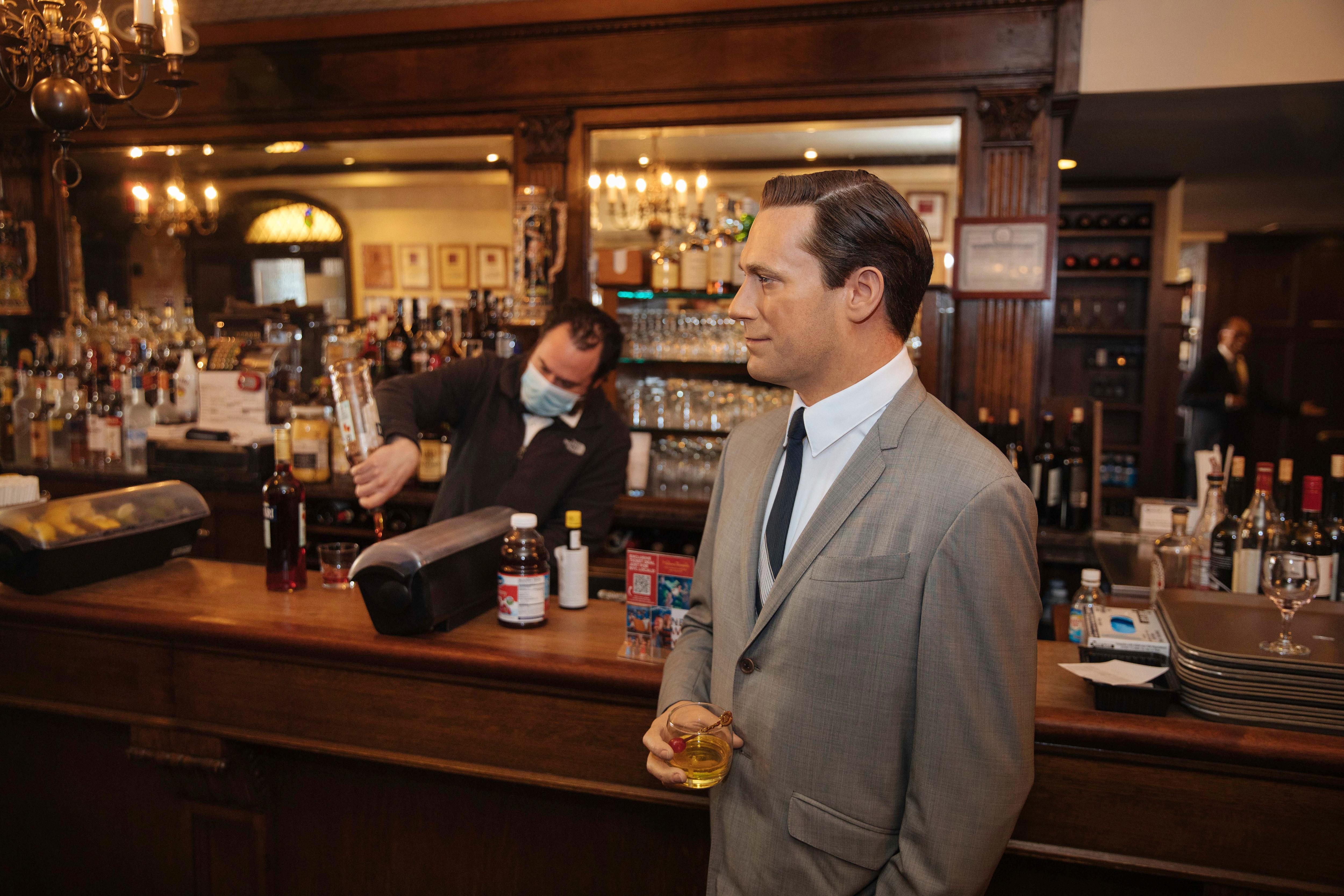 A wax statue of actor John Hamm stands by the bar with a drink at Peter Luger Steakhouse.(AP) A wax statue of actor John Hamm stands by the bar with a drink at Peter Luger Steakhouse.(AP)