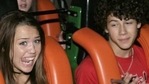 Miley Cyrus with Nick Jonas. Miley Cyrus with Nick Jonas.