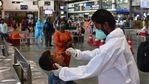 A health worker wearing protective gear takes a nasal swab sample of inbound travellers for Covid-19 tests at CSMT railway station in Mumbai.(Bhushan Koyande/HT Photo) A health worker wearing protective gear takes a nasal swab sample of inbound travellers for Covid-19 tests at CSMT railway station in Mumbai.(Bhushan Koyande/HT Photo)