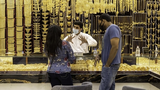 A salesman speaks to customers in a jewelry store in the Gold Souk in the Deira district of Dubai, United Arab Emirates, on Tuesday, Feb. 9, 2021. (Bloomberg)