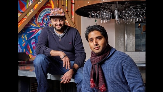 “We’re trying to simplify the entire objective of the Indian food,” says chef Chintan Pandya (left) who has created a menu that breaks free from butter chicken and tikka masalas, with restaurateur Roni Mazumdar at Dhamaka. (Adam Friedlander)