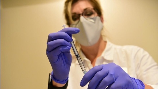 A Johnson & Johnson worker prepares a syringe during the Phase 3 trial of its coronavirus vaccine candidate in an undated photograph. (REUTERS FILE) A Johnson & Johnson worker prepares a syringe during the Phase 3 trial of its coronavirus vaccine candidate in an undated photograph. (REUTERS FILE)