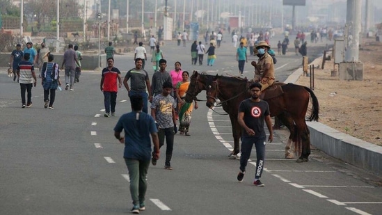 People above 65 years of age, those with comorbidities, pregnant women and children below 10 years of age should take necessary precautions, the government advised. In picture - people near the Marina beach in Chennai.(ANI)